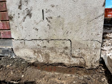 An Underpinning Vermont Team working on to underpin a house